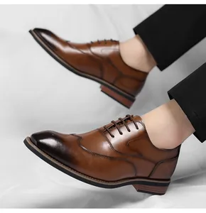 Detailed side profile of classic brown leather wingtip Oxford shoes for professional men.