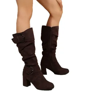 Brown suede mid-calf boots for women featuring buckle straps and chunky high heels.