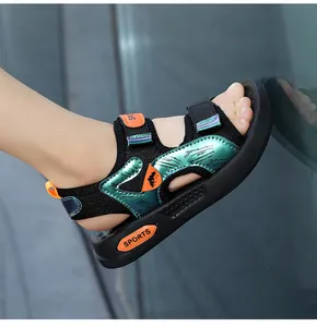 Detailed view of children's non-slip sports sandals with green metallic and orange accents