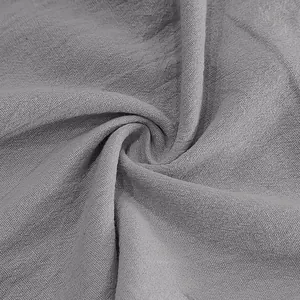 Close-up of breathable grey linen fabric texture for men's casual beach pants