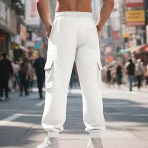Detailed back view of white waffle knit cargo joggers featuring side pockets and cuffs