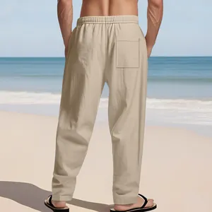 Back view detail of men's breathable beige linen straight leg trousers on beach