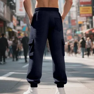 Detailed back view of men's navy blue heavy jacquard waffle knit casual cargo pants