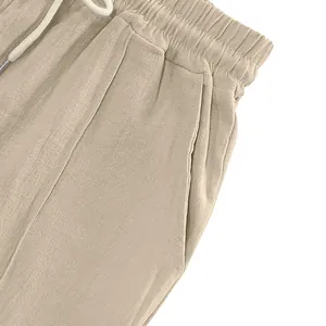 Macro detail of breathable linen fabric and drawstring on khaki men's casual pants