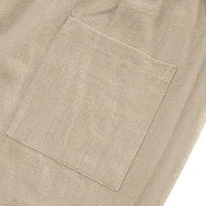 Close-up detail of the pocket and breathable linen fabric of men's casual trousers.