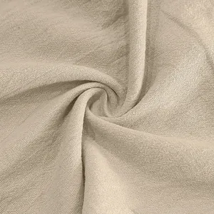 Detailed macro view showing the natural breathable texture of beige linen fabric.