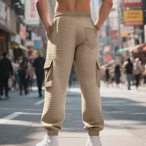 Detailed back view of men's waffle-knit cargo joggers in khaki with utility side pockets