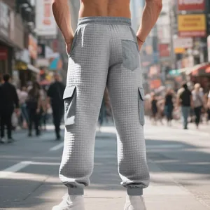 Back view of men's grey jacquard cargo pants featuring waffle texture and pockets