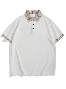 Detail view of men's white polo shirt with plaid collar and waffle knit texture.