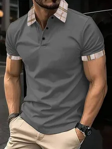 Detailed view of a grey men's polo shirt featuring a classic plaid collar and button detail