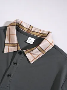 Close-up of men's polo shirt detailing the plaid collar and waffle textured fabric