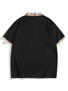 Back view of men's black short-sleeve polo shirt with plaid collar and cuff detail