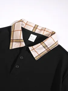 Close-up of men's black polo shirt with breathable pique texture and plaid collar detail