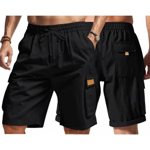 Detail view of men's black tactical cargo shorts with multi-pockets and drawstring.