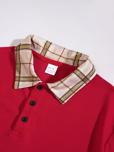 Close-up detail of a red Polo shirt with plaid collar and buttons showing fabric texture