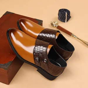 Close-up of elegant dual-texture men's monk strap dress shoes with crocodile pattern