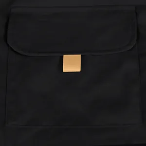 Close-up detail of a functional flap pocket on black tactical cargo shorts for men