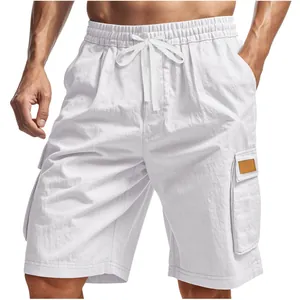 Close-up of white mens cargo shorts with elastic drawstring waist and side pocket