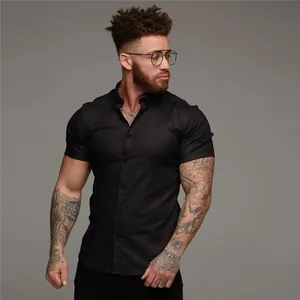 Slim fit men's black short sleeve muscle shirt featuring a classic turn-down collar