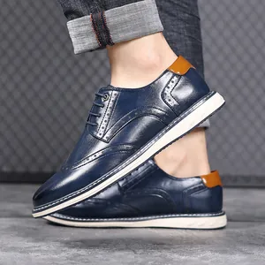 Detailed macro view of blue leather Brogue shoes with intricate perforation details
