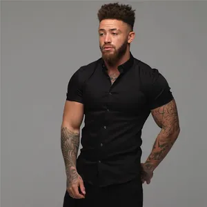 Detailed view of men's muscle fit black short-sleeved shirt with a button-down collar