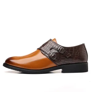 Men's monk strap dress shoes with brown crocodile texture and dual metal buckles.