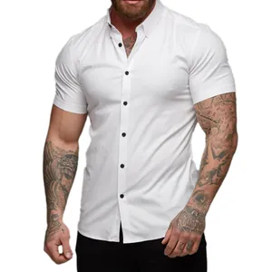 Detailed macro view of a men's white muscle fit short sleeve shirt featuring black buttons