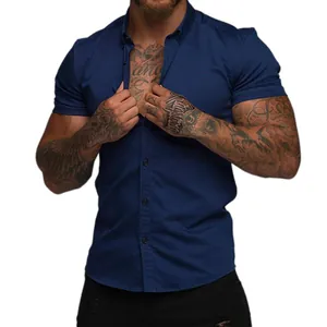 Close-up detail of a navy blue muscle fit short sleeve shirt with a classic lapel collar