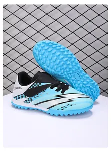 Detail view of blue children's TF turf soccer shoes with hook and loop closure