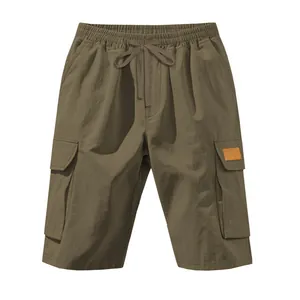 Detailed view of casual khaki cargo shorts with elastic drawstring waist and large pockets.