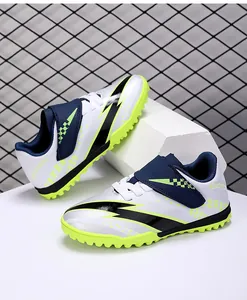 High-performance youth soccer shoes with velcro straps and lime green turf cleats