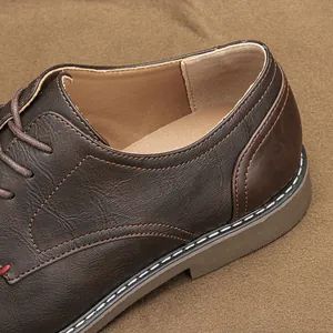 Close-up detail of retro brown leather men's shoe showing fine stitching and texture