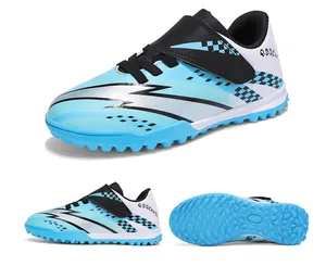 Children's light blue TF soccer shoes featuring Velcro strap and textured rubber cleats