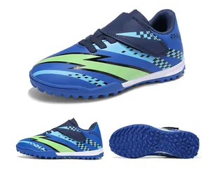 Blue and green kids soccer shoes with TF studs and easy velcro strap closure.