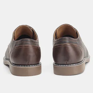 Professional detailed rear view of men's vintage brown casual low-top leather shoes.