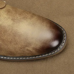 Macro detail of men's vintage leather shoe toe with stylish brown color gradient