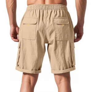 Rear view of men's khaki cargo shorts showing large pocket details and an elastic waistband