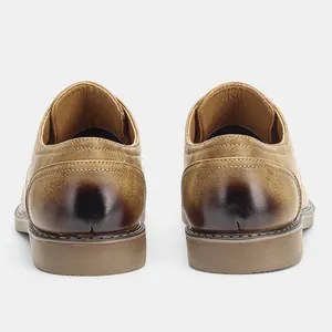 Back view detail of vintage brown leather casual shoes for men showing textured heel