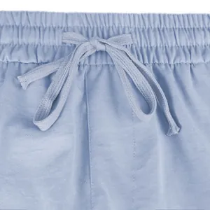 Close-up of elastic waistband and drawstring on light blue casual tactical shorts