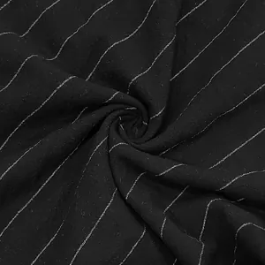 Close-up of black breathable linen fabric with elegant white vertical pinstripe pattern