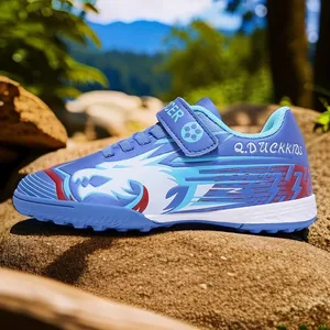 Chaussures de football bleues pour enfants avec graphismes de dragon et bandes scratch