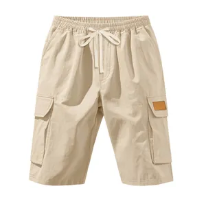 Detailed view of casual men's cargo shorts featuring a drawstring waist and pockets.