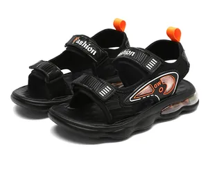 Sandalias deportivas negras para niño con suela de cámara de aire naranja y malla