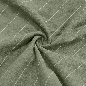 Close-up of breathable olive green linen fabric with white vertical pinstripe texture.