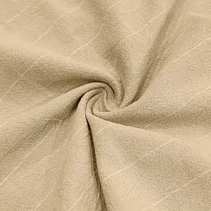 Macro view showing the breathable linen fabric texture and vertical stripes for men's shorts