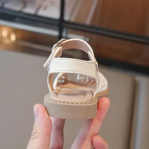 Back view of cream breathable woven children sandals with soft rubber sole for girls
