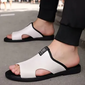 Close-up view of men's white breathable non-slip beach sandals with black soles on feet