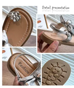 Detailed close-up shots of girls silver bow sandals featuring rhinestone flower accents