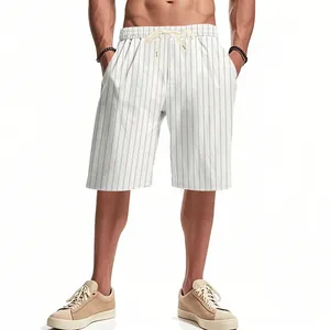 Detailed shot of men's white pinstriped linen beach shorts featuring a drawstring waist