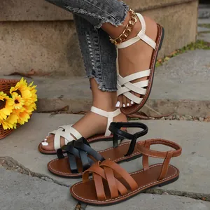 Detailed view of women's summer flat Roman sandals available in white, black, and brown colors